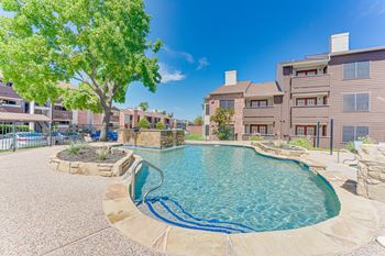 Swimming pool surrounded by a stone patio
